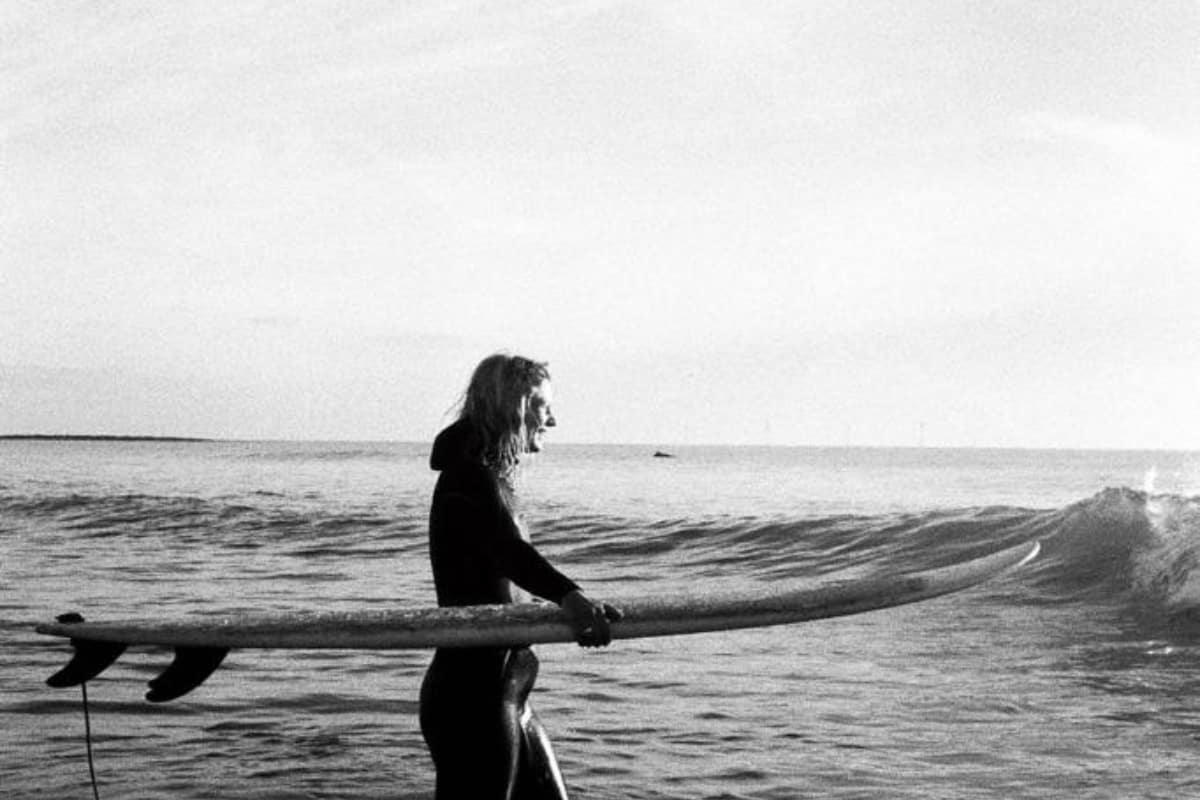 sisters and the sea women with surfboard