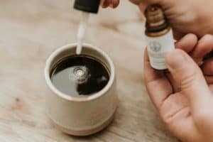 cbd mylk being dropped into coffee